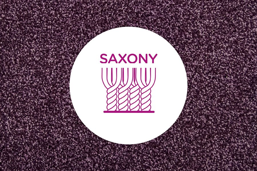 Cross section of cut pile yarns in a saxony carpet on a neutral carpet background